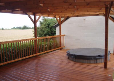 A deck and pergola stained and weatherproofed